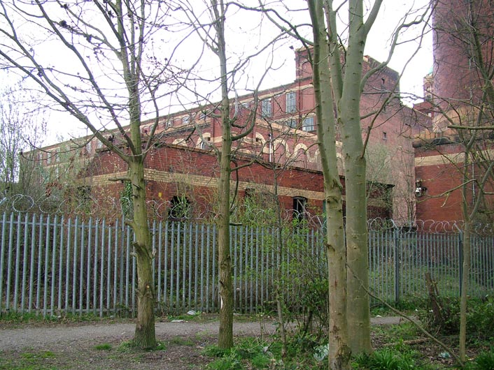 Derelict mill and barbed wire