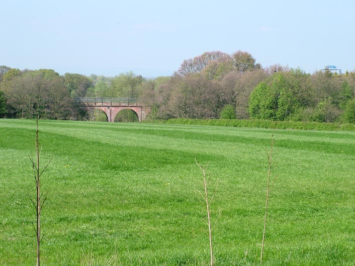 View across countryside, note blue motorway sign on right