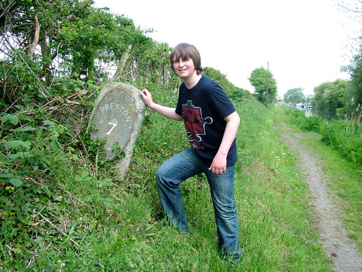 Posing or trying to straigthen mileage marker?