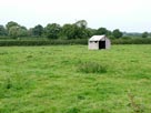 A lone shed in a field A lone shed in a field