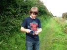 Thomas playing with a bullrush Thomas playing with a bullrush